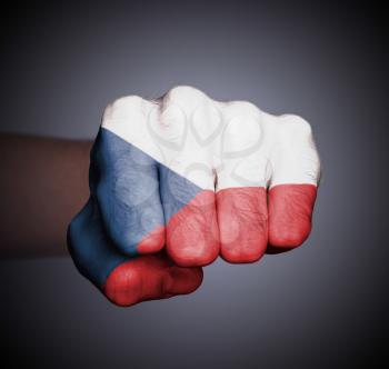 Front view of punching fist on gray background, flag of the Czech Republic