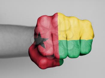 Fist of a man punching, flag of Guinea-Bissau