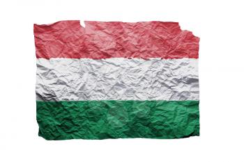 Close up of a curled paper on white background, print of the flag of Hungary