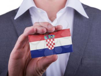 Businessman showing card, matte paper effect, Croatia