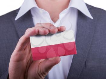 Businessman showing card, matte paper effect, Poland