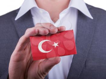 Businessman showing card, matte paper effect, Turkey