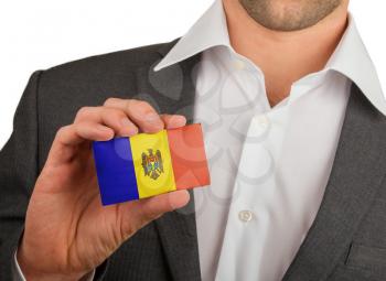 Businessman is holding a business card, flag of Andorra