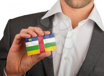Businessman is holding a business card, flag of The Central African Republic