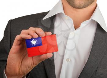 Businessman is holding a business card, flag of Republic of China