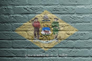 Brick wall with a painting of a flag isolated, Delaware