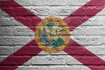 Brick wall with a painting of a flag isolated, Florida