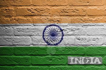 Brick wall with a painting of a flag isolated, India