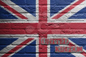 Brick wall with a painting of a flag isolated, UK