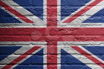Brick wall with a painting of a flag isolated, UK