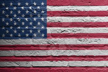 Brick wall with a painting of a flag isolated, USA