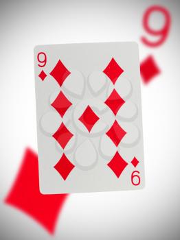 Playing card with a blurry background, nine