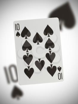 Playing card with a blurry background, ten of spades