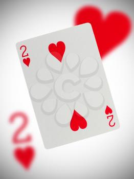 Playing card with a blurry background, two of hearts