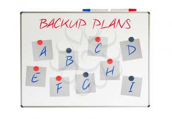 Backup plans on papers on a whiteboard, isolated on white