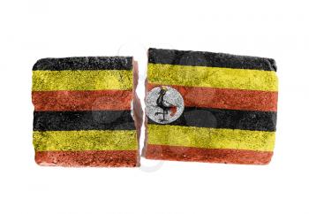 Rough broken brick, isolated on white background, flag of Uganda