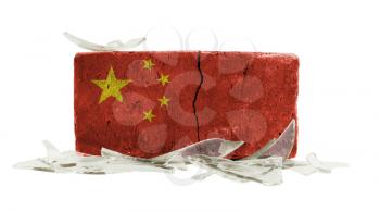 Brick with broken glass, violence concept, flag of China