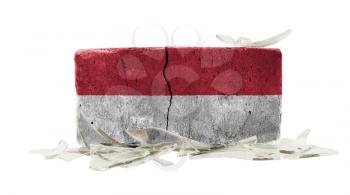 Brick with broken glass, violence concept, flag of Indonesia