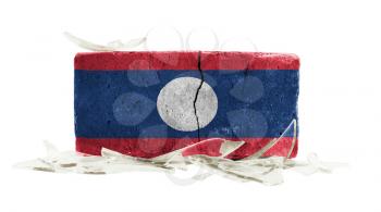 Brick with broken glass, violence concept, flag of Laos