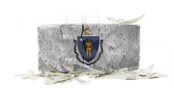 Brick with broken glass, violence concept, flag of Massachusetts
