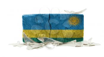 Brick with broken glass, violence concept, flag of Rwanda