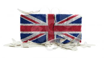 Brick with broken glass, violence concept, flag of the UK
