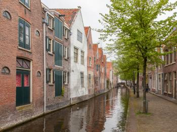 Traditional dutch buildings on canal in Alkmaar, the Netherlands
