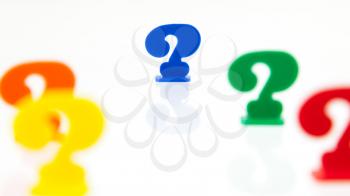 Different colored unique pawns isolated on a white background