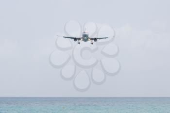 Unrecognisable airplane landing on the Caribbean isle of Saint Martin