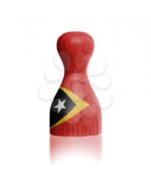 Wooden pawn with a painting of a flag, East Timor