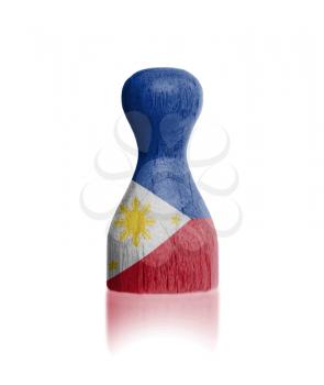 Wooden pawn with a painting of a flag, the Philippines