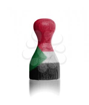 Wooden pawn with a painting of a flag, Sudan