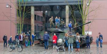 Leeuwarden, The Netherlands - april 6: Civilians can for once see and climb a dutch Combat Vehicle 90 in the city of Leeuwarden on April 6, 2014.