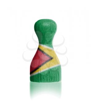 Wooden pawn with a painting of a flag, Guyana