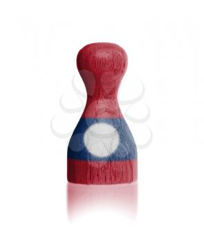 Wooden pawn with a painting of a flag, Laos