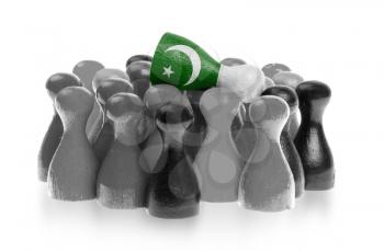 One unique pawn on top of common pawns, flag of Pakistan