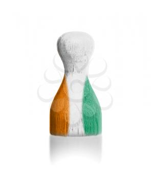 Wooden pawn with a painting of a flag, Ivory Coast