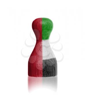 Wooden pawn with a painting of a flag, UAE