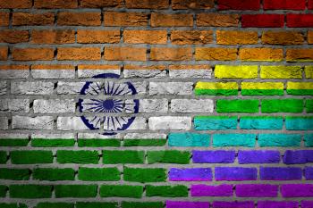 Dark brick wall texture - coutry flag and rainbow flag painted on wall - India
