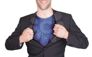 Businessman opening suit to reveal shirt with state flag (USA), Alaska
