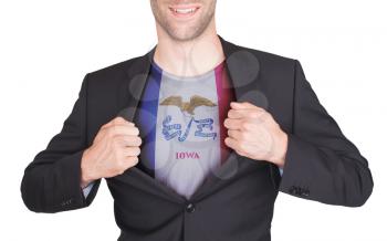 Businessman opening suit to reveal shirt with state flag (USA), Iowa