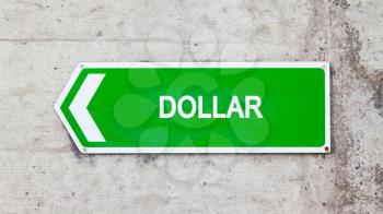 Green sign on a concrete wall - Dollar