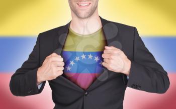 Businessman opening suit to reveal shirt with flag, Venezuela