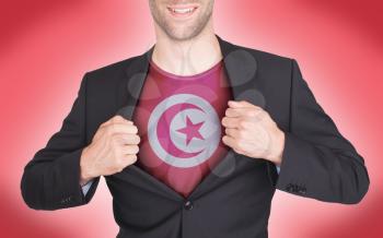 Businessman opening suit to reveal shirt with flag, Tunisia