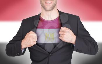 Businessman opening suit to reveal shirt with flag, Egypt