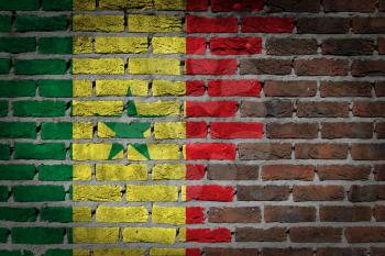 Very old dark red brick wall texture with flag - Senegal