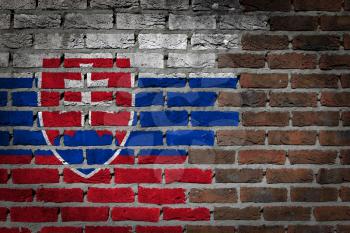 Very old dark red brick wall texture with flag - Slovakia