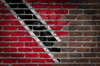Very old dark red brick wall texture with flag - Trinidad and Tobago