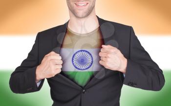 Businessman opening suit to reveal shirt with flag, India