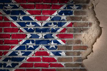 Dark brick wall texture with plaster - flag painted on wall - Confederate flag